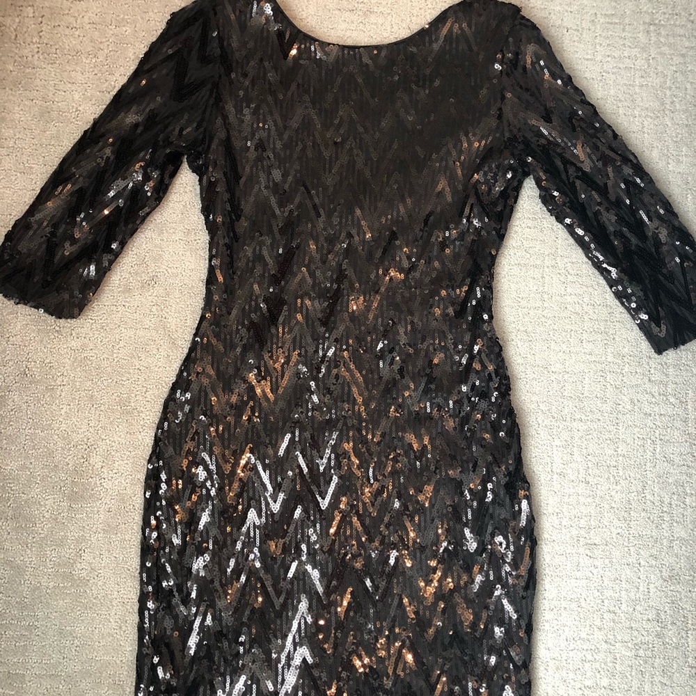 Small black sequin dress with low cut back